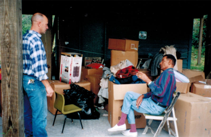 Papa Bear and Phil Molloy sharing stories while working together on a coat and clothing drive in which 100+ boxes were packed and shipped to Pine Ridge, Porcupine and He-Dog reservations.